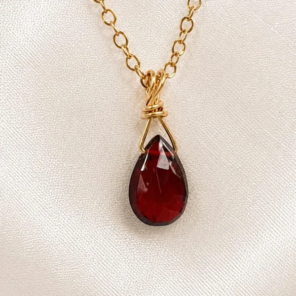 Close-up of natural Garnet gemstone pendant in Gold Filled or Sterling Silver