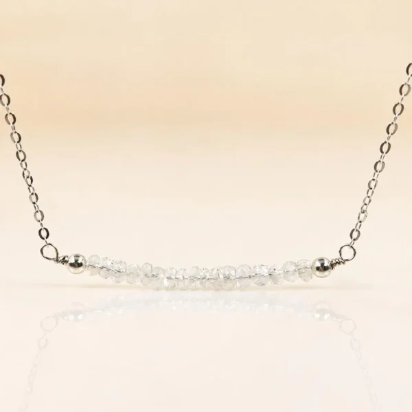 Close-up of faceted moonstone bar pendant on a delicate sterling silver chain