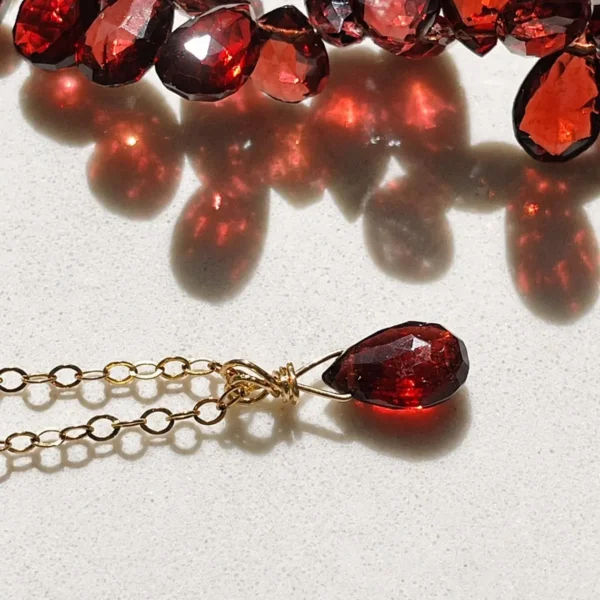 Close-up of natural Garnet gemstone pendant in Gold Filled or Sterling Silver