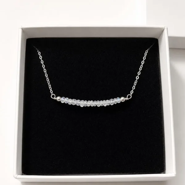 Minimalist moonstone bar necklace showing handcrafted silver chain details