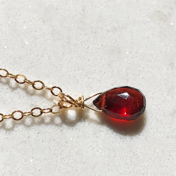 Close-up of natural Garnet gemstone pendant in Gold Filled or Sterling Silver