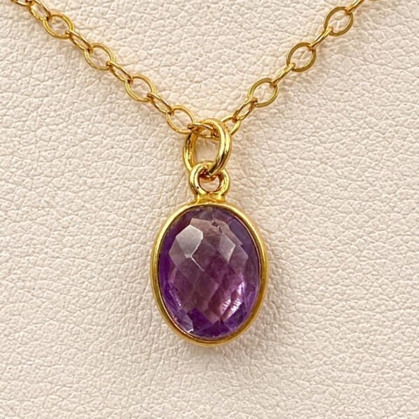 Close-up of natural Amethyst gemstone showing purple tones and faceted details