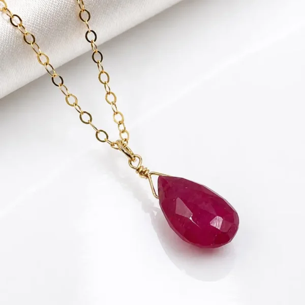Minimalist Garnet pendant necklace showing deep red natural gemstone tones