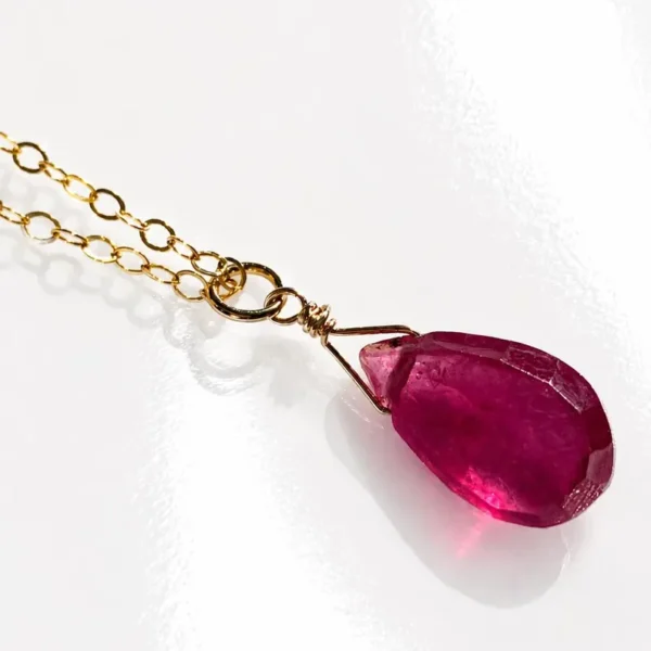 Minimalist Garnet pendant necklace showing deep red natural gemstone tones