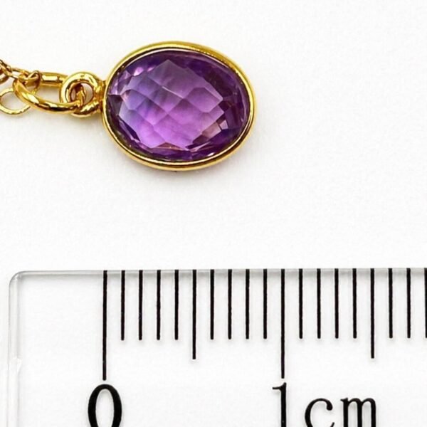 Close-up of natural Amethyst gemstone showing purple tones and faceted details