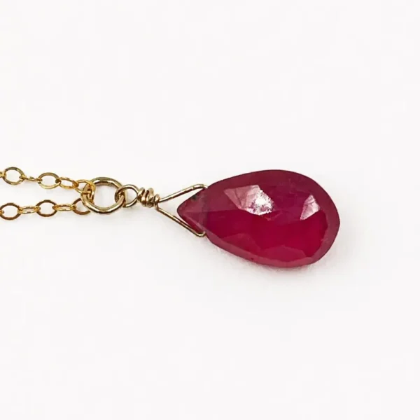 Minimalist Garnet pendant necklace showing deep red natural gemstone tones