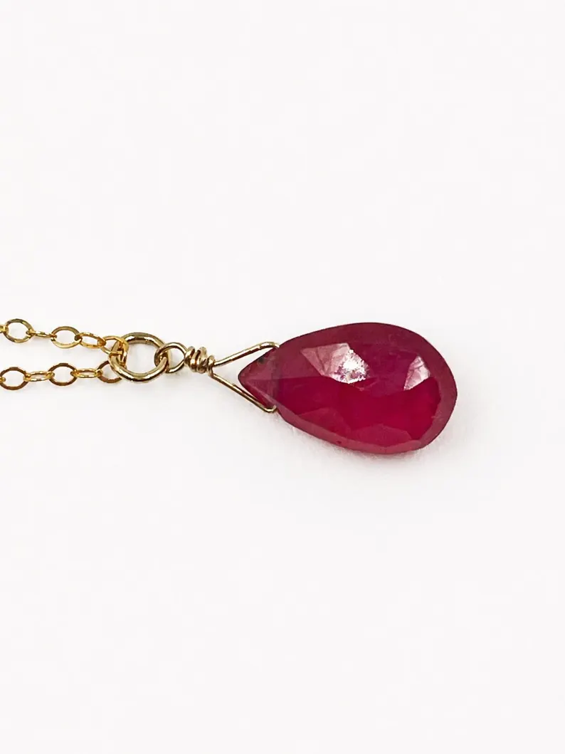 Minimalist Garnet pendant necklace showing deep red natural gemstone tones