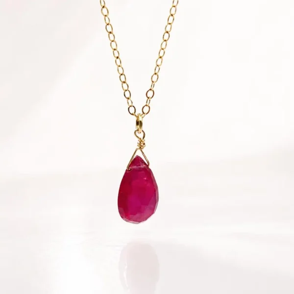 Minimalist Garnet pendant necklace showing deep red natural gemstone tones