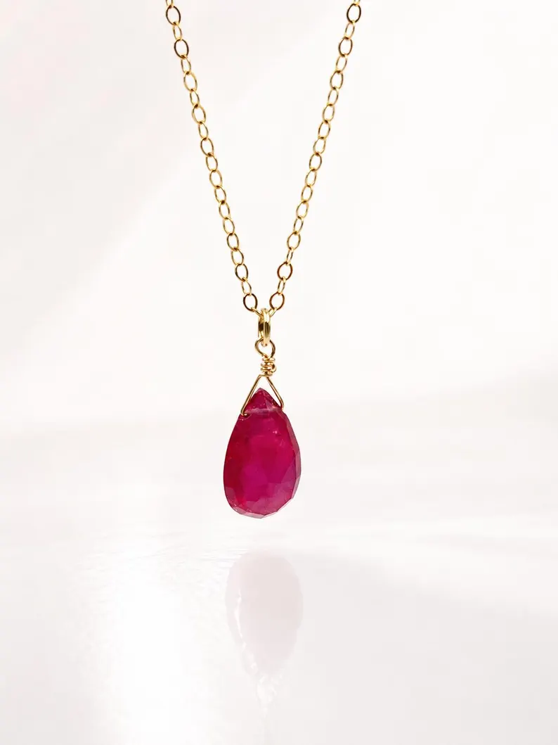 Minimalist Garnet pendant necklace showing deep red natural gemstone tones