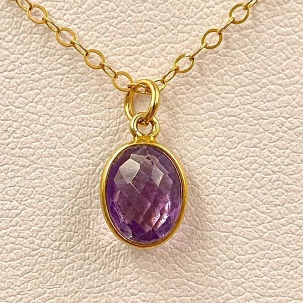 Close-up of natural Amethyst gemstone showing purple tones and faceted details