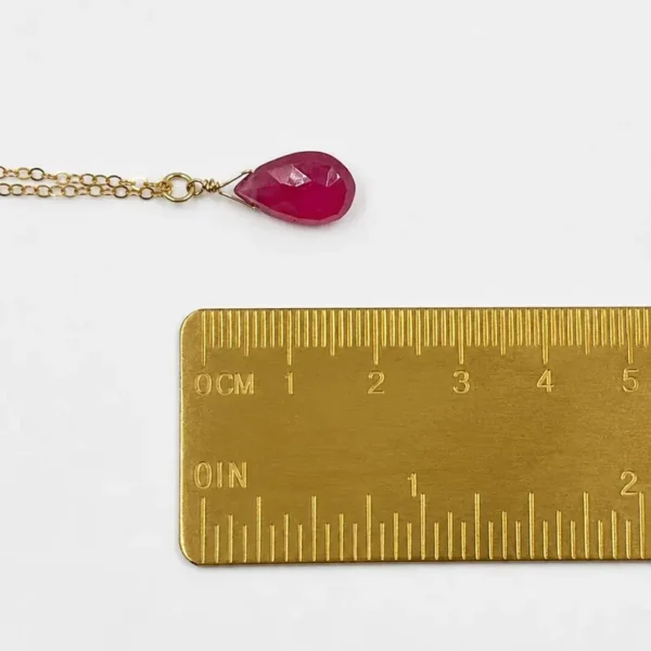 Minimalist Garnet pendant necklace showing deep red natural gemstone tones