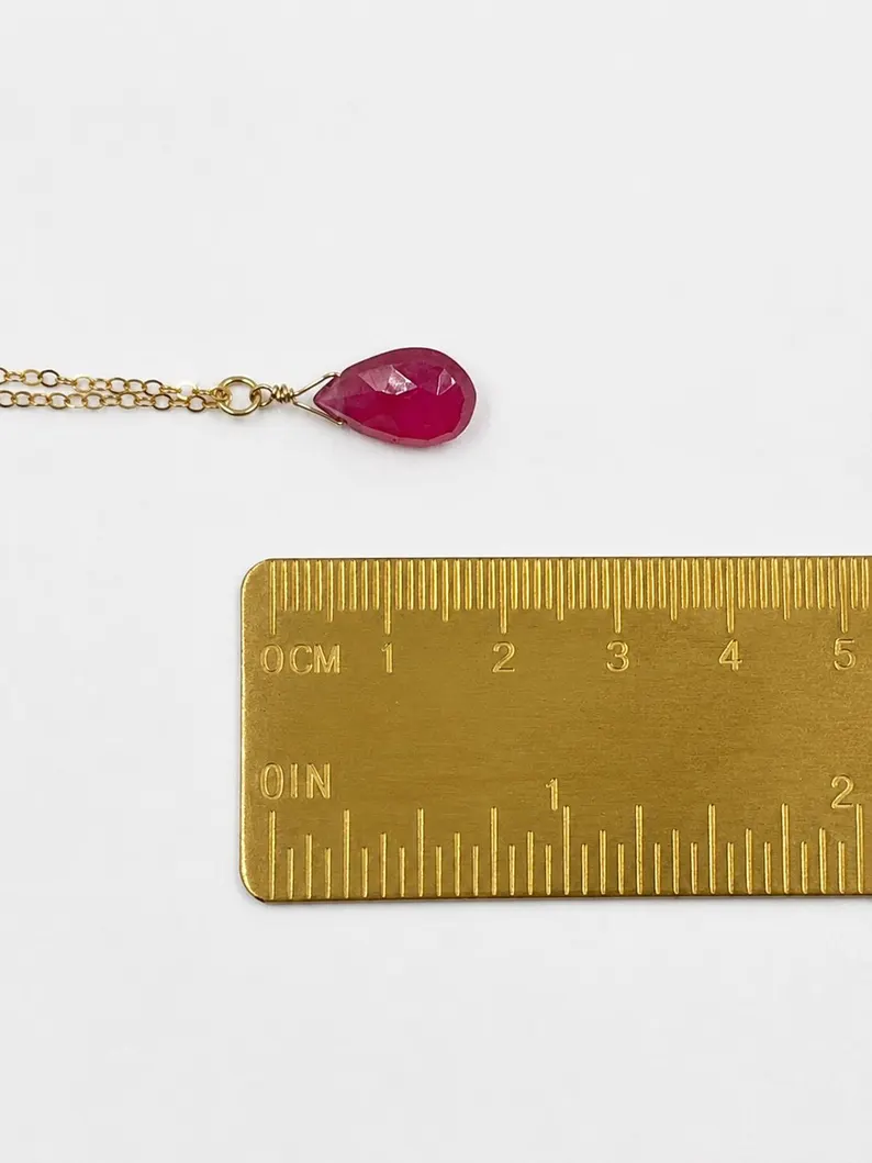 Minimalist Garnet pendant necklace showing deep red natural gemstone tones